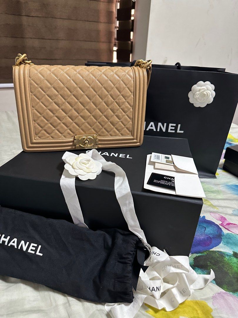 Authentic Chanel boy (Category: Luxury Bags & Wallets) located in Pasig City. Submitted by queenofmybabies (Listing ID 1328985064, Image 1). Description: This Chanel Beige Caviar 2018 Leboy handbag is a timeless classic, perfect for adding a touch of elegance to any outfit. Crafted from luxurious beige caviar leather, it features stunning gold-tone hardware that complements its iconic design. Though gently used, it remains in excellent condition 