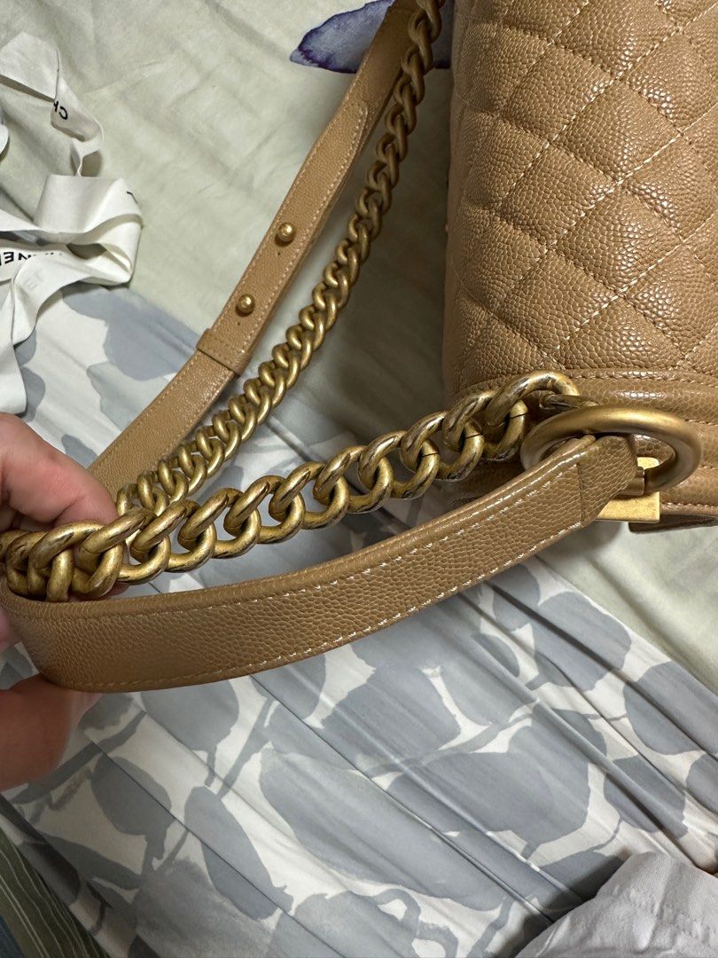 Authentic Chanel boy (Category: Luxury Bags & Wallets) located in Pasig City. Submitted by queenofmybabies (Listing ID 1328985064, Image 3). Description: This Chanel Beige Caviar 2018 Leboy handbag is a timeless classic, perfect for adding a touch of elegance to any outfit. Crafted from luxurious beige caviar leather, it features stunning gold-tone hardware that complements its iconic design. Though gently used, it remains in excellent condition 