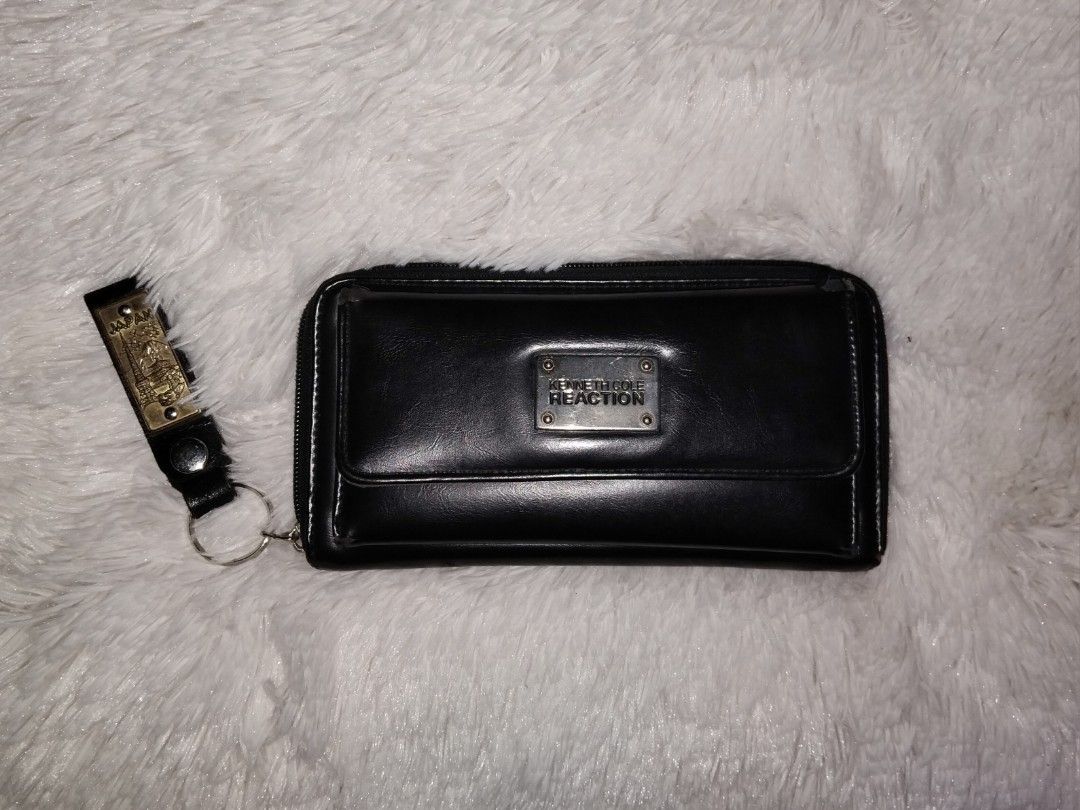 Authentic Kenneth Cole Long Wallet (Category: Wallets & Card holders) located in Bulacan. Submitted by rin2024 (Listing ID 1329086522, Image 1). Description: Authentic Kenneth Cole Leather Long Wallet - 18 total card slots - 5 total bill holders - With zippered coin pouch Heavily used, but has really useful and organized wallet compartments. This wallet has a space for a lot of daily items. Condition: - Missing main compartment puller - Leather p