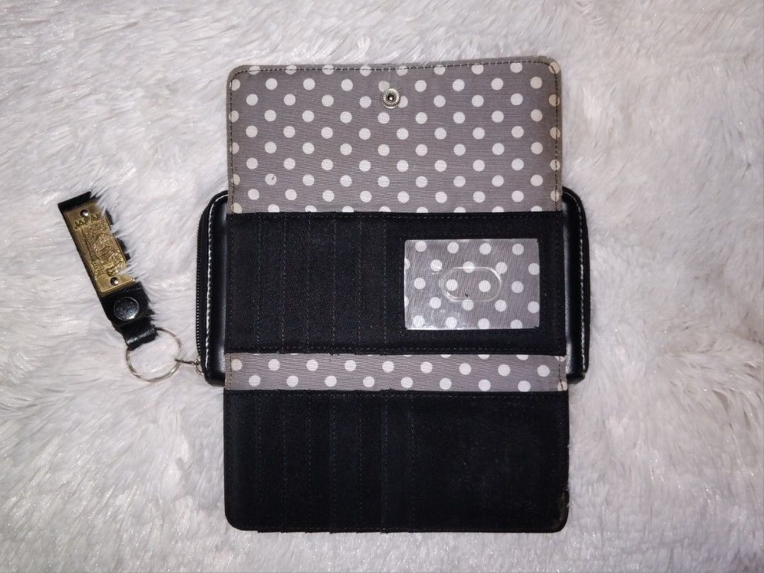 Authentic Kenneth Cole Long Wallet (Category: Wallets & Card holders) located in Bulacan. Submitted by rin2024 (Listing ID 1329086522, Image 3). Description: Authentic Kenneth Cole Leather Long Wallet - 18 total card slots - 5 total bill holders - With zippered coin pouch Heavily used, but has really useful and organized wallet compartments. This wallet has a space for a lot of daily items. Condition: - Missing main compartment puller - Leather p