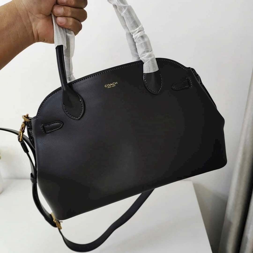 Coach Empire Carryall Bag 28 Black (Category: Tote Bags) located in Manila. Submitted by stacey_lopez922 (Listing ID 1328989542, Image 2). Description: Coach Empire Carryall Bag 28 Black (With dustbag and paperbag) - 35.5cm (L) x 21.5cm (H) x 16cm (W) - Glovetanned leather - Inside snap pocket - Center zip compartment - Fabric lining - Handles with 9.5cm drop - Detachable strap with 54.5cm drop for shoulder or crossbody wear - Four protective fee