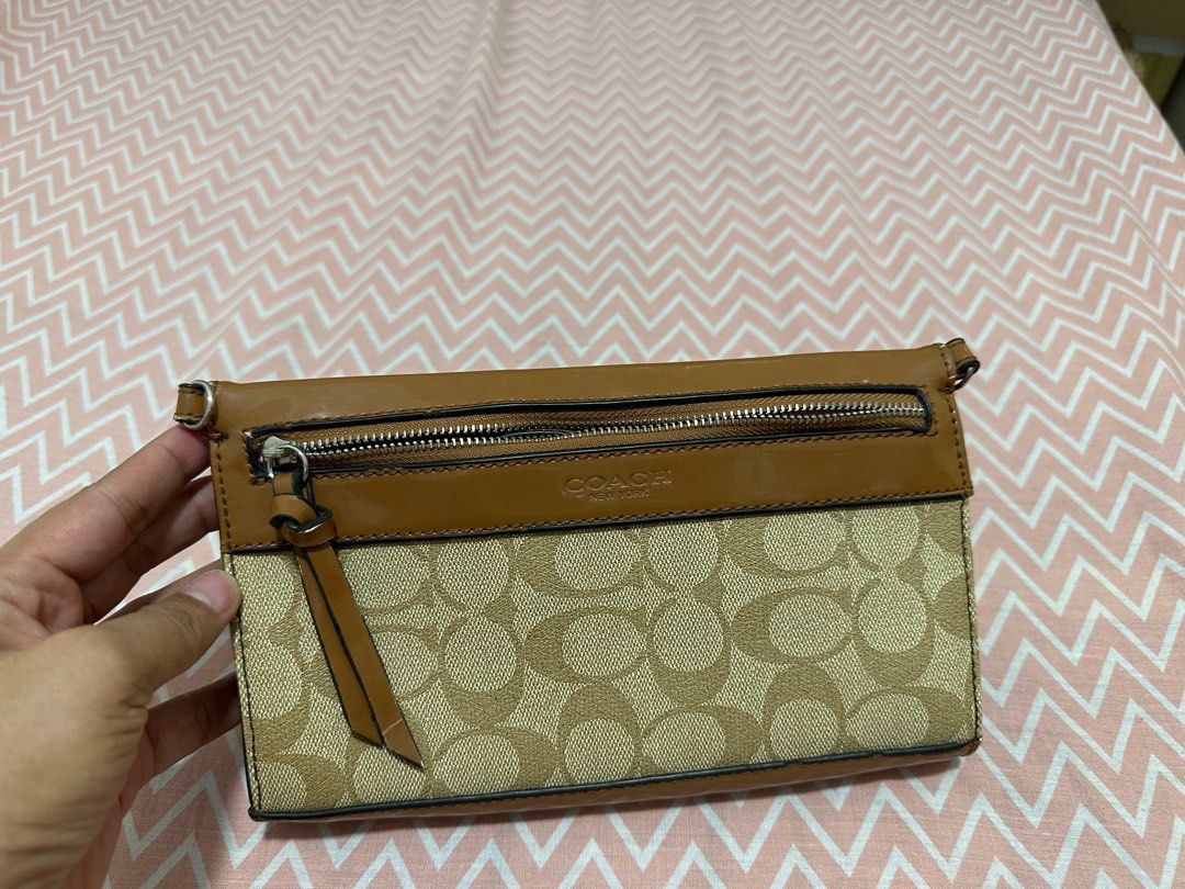 COACH WALLET with SLING (Category: Luxury Bags & Wallets) located in Makati City. Submitted by declutterwithjz (Listing ID 1328957743, Image 1). Description: Front zipper needs repair.