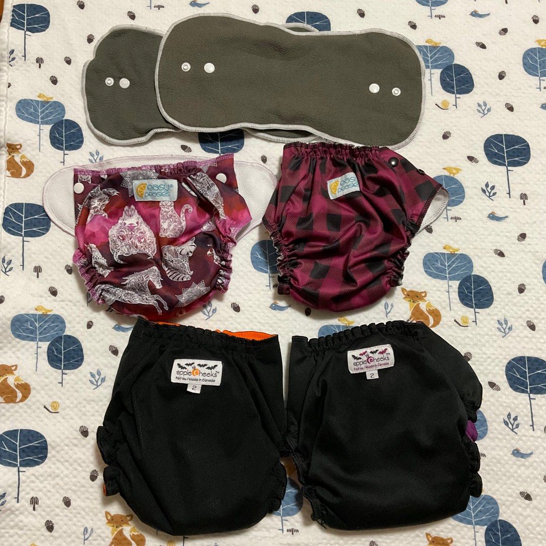Easy Peasies and Apple Cheeks Pocket Type Cloth Diapers (Category: Diapers & Baby Wipes) located in San Juan City. Submitted by joee04 (Listing ID 1329054083, Image 1). Description: US-brand cloth diaper (pocket type) Each were used at best 5-6 times only, and machine-washed in delicate setting. Garters are still good, no cracks or holes on the PUL of the diaper covers. Soft to skin because of the fleece cover while inserts may be used to customi