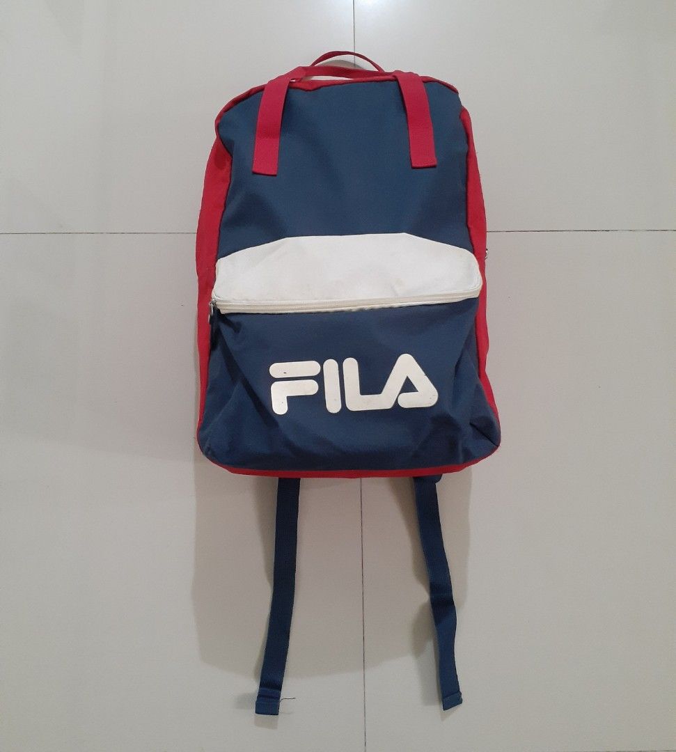 FILA Tri-Color BackPack (Category: Backpacks) located in Candaba. Submitted by ThrifthingsPH02 (Listing ID 1328976495, Image 1). Description: Selling FILA Tri-Color BackPack 11.5" x 17" x 5" Well used Condition Can Fit A4 Laptop Compartment Suitable For School Spacious Interior flaws : Scratch , Washable Stain and In Sling Scratch on reflectorize Details Php 849 add sf only Pampang Location Can do shipping PM for serious buyer Can send more photo