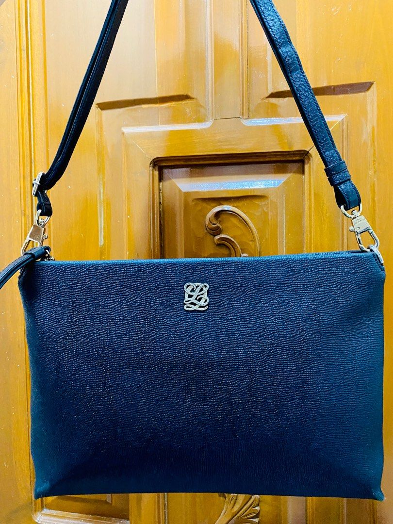 Louis Quatorze Sling Bag (Category: Luxury Bags & Wallets) located in Bay. Submitted by baggsy416 (Listing ID 1329018791, Image 1). Description: Original Louis Quatorze Black in color Issue: please refer to photos.