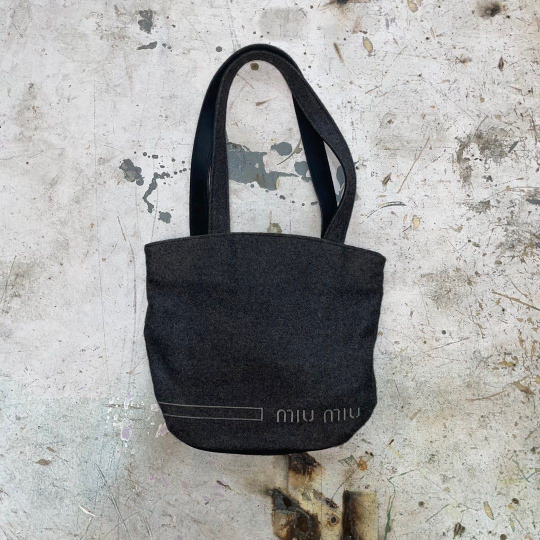 MIU MIU BY PRADA TOTE/HAND BAG (Category: Luxury Bags & Wallets) located in Manila. Submitted by revise.ph_ (Listing ID 1328734984, Image 1). Description: MIU MIU BY PRADA TOTE/HAND BAG Made in ITALY Dimension Length/Height:10 Width:11.5 Side Width: issue:None Price:4,000 Free shipping via JNT.