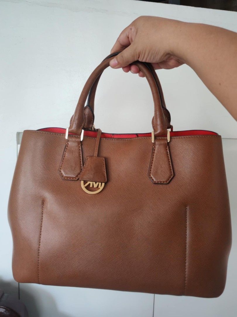 Original MK bag with sling (Category: Luxury Bags & Wallets) located in Cavite. Submitted by purelabels_alexandsofia (Listing ID 1329040351, Image 2). Description: preloved, very excellent condition but with flaws not noticeable leather materials with sling It comes with dust bag color brown original MK bag.