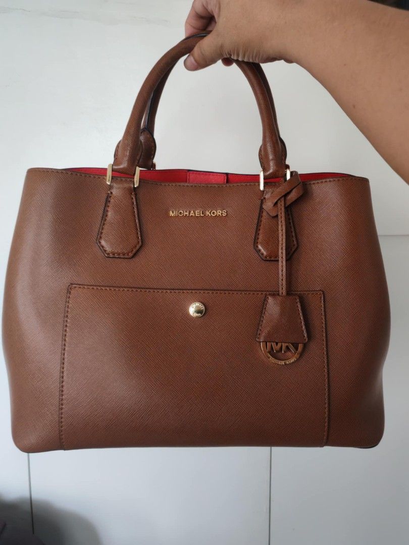 Original MK bag with sling (Category: Luxury Bags & Wallets) located in Cavite. Submitted by purelabels_alexandsofia (Listing ID 1329040351, Image 1). Description: preloved, very excellent condition but with flaws not noticeable leather materials with sling It comes with dust bag color brown original MK bag.