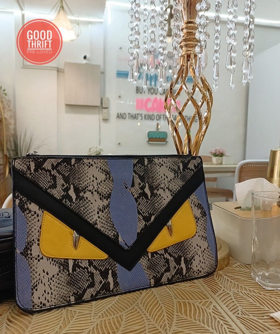 Rare Fendi Monster Python Leather Flat clutch / Pouch (Category: Luxury Bags & Wallets) located in Santa Maria. Submitted by prettyiu (Listing ID 1329034025, Image 1). Description: Rare Fendi Monster Python Leather Flat clutch / Pouch Excellent Condition Negotiable..