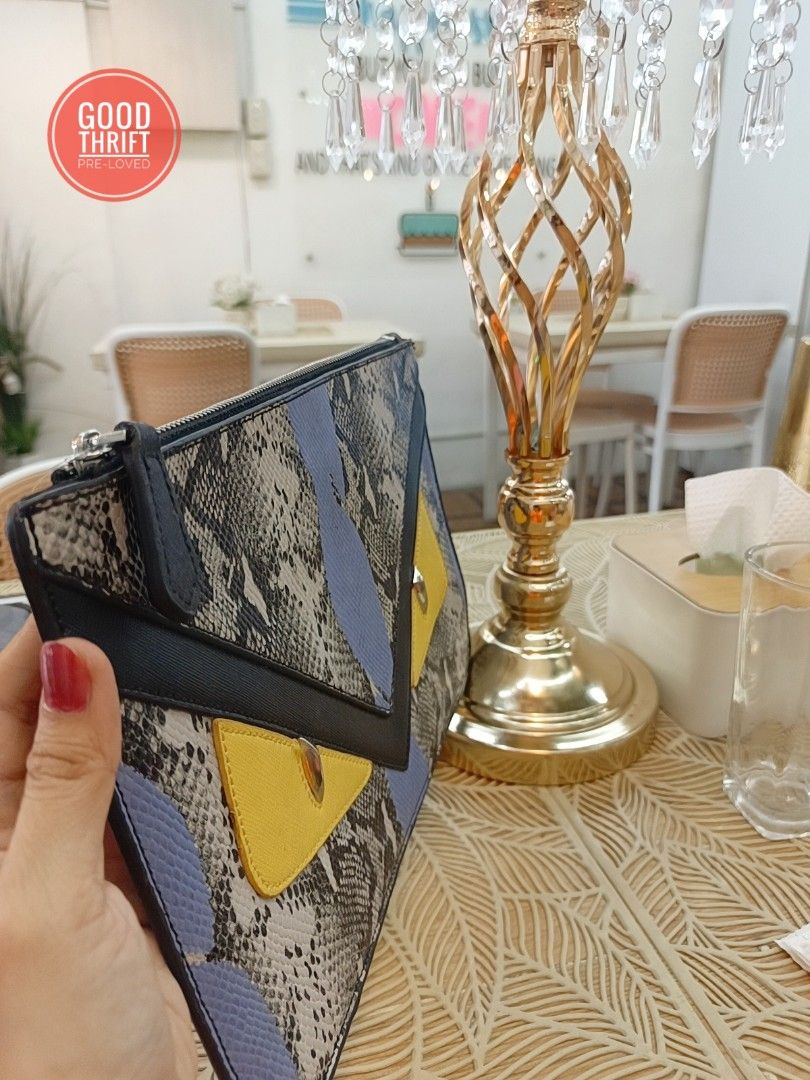 Rare Fendi Monster Python Leather Flat clutch / Pouch (Category: Luxury Bags & Wallets) located in Santa Maria. Submitted by prettyiu (Listing ID 1329034025, Image 3). Description: Rare Fendi Monster Python Leather Flat clutch / Pouch Excellent Condition Negotiable..