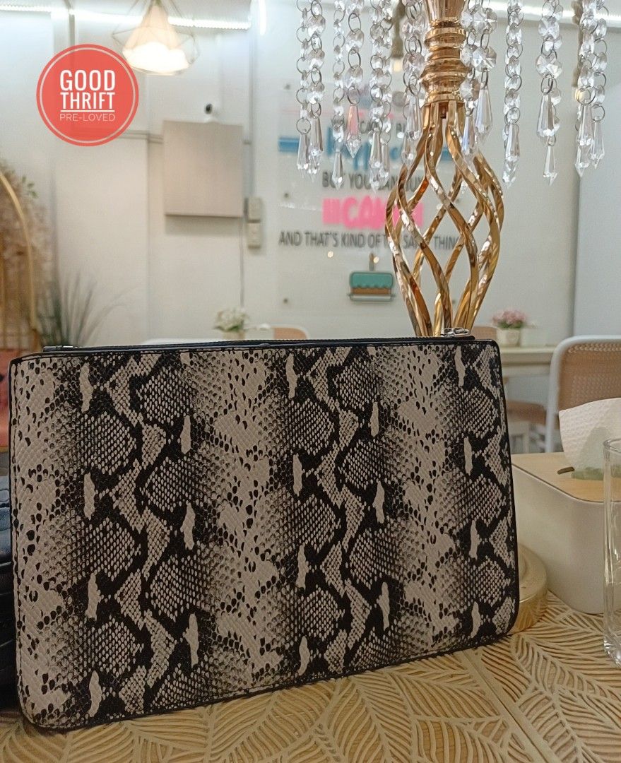 Rare Fendi Monster Python Leather Flat clutch / Pouch (Category: Luxury Bags & Wallets) located in Santa Maria. Submitted by prettyiu (Listing ID 1329034025, Image 2). Description: Rare Fendi Monster Python Leather Flat clutch / Pouch Excellent Condition Negotiable..