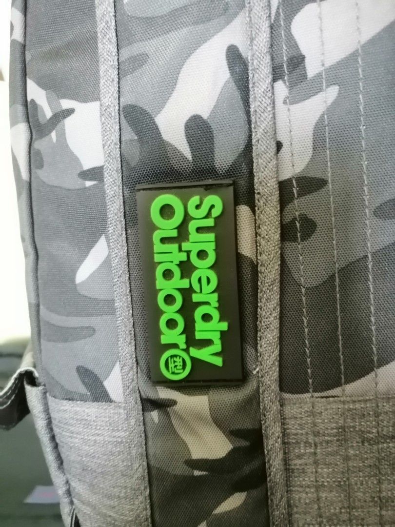 Superdry backpack (Category: Backpacks) located in Quezon City. Submitted by annyeong9 (Listing ID 1329001362, Image 3). Description: Superdry backpack camouflaged moss green. Small to medium size. Original from Japan. P1, 500.00. With very minimal flaws but hardly seen. Just sign of usage. For school or office daily use. Pang Gen Z to A. 😁😂🙏🤭. PM for details and price..