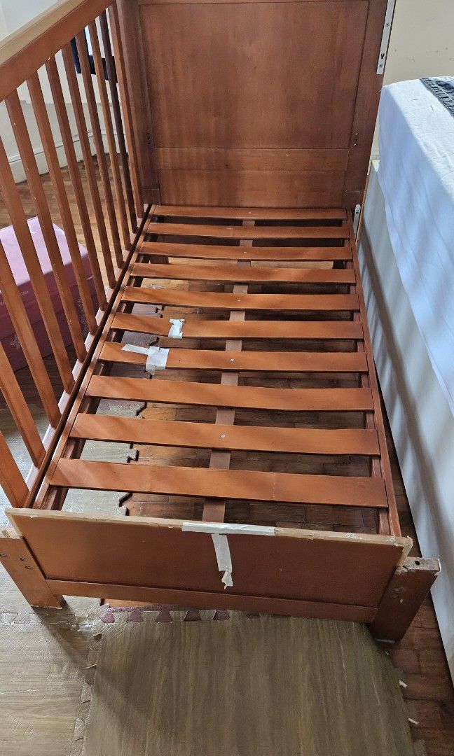 Pre-loved crib/toddler bed (Category: Cots & Cribs) located in Pasig City. Submitted by kim.es06 (Listing ID 1329109734, Image 1). Description: -Wooden crib convertible to toddler bed -has damages and needs to be repaired - available for pick-up by 3rd week of October - slightly negotiable - with mattress and free bed sheets Rfs- moving out sale.
