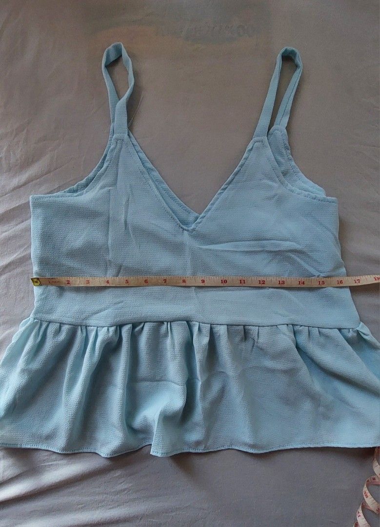 Sky Blue Sleeveless Peplum Top (Category: Sleeveless) located in Makati City. Submitted by allyrchives (Listing ID 1329211220, Image 3). Description: Sky Blue Sleeveless Peplum Top L: 21 in B: 33 - 34 in - soft light fabric - better layered on top of a shirt rfs: decluttering.