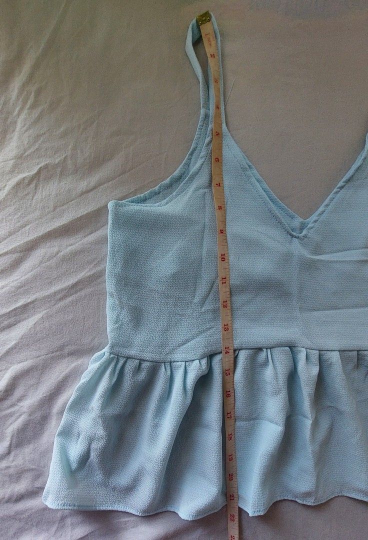 Sky Blue Sleeveless Peplum Top (Category: Sleeveless) located in Makati City. Submitted by allyrchives (Listing ID 1329211220, Image 2). Description: Sky Blue Sleeveless Peplum Top L: 21 in B: 33 - 34 in - soft light fabric - better layered on top of a shirt rfs: decluttering.