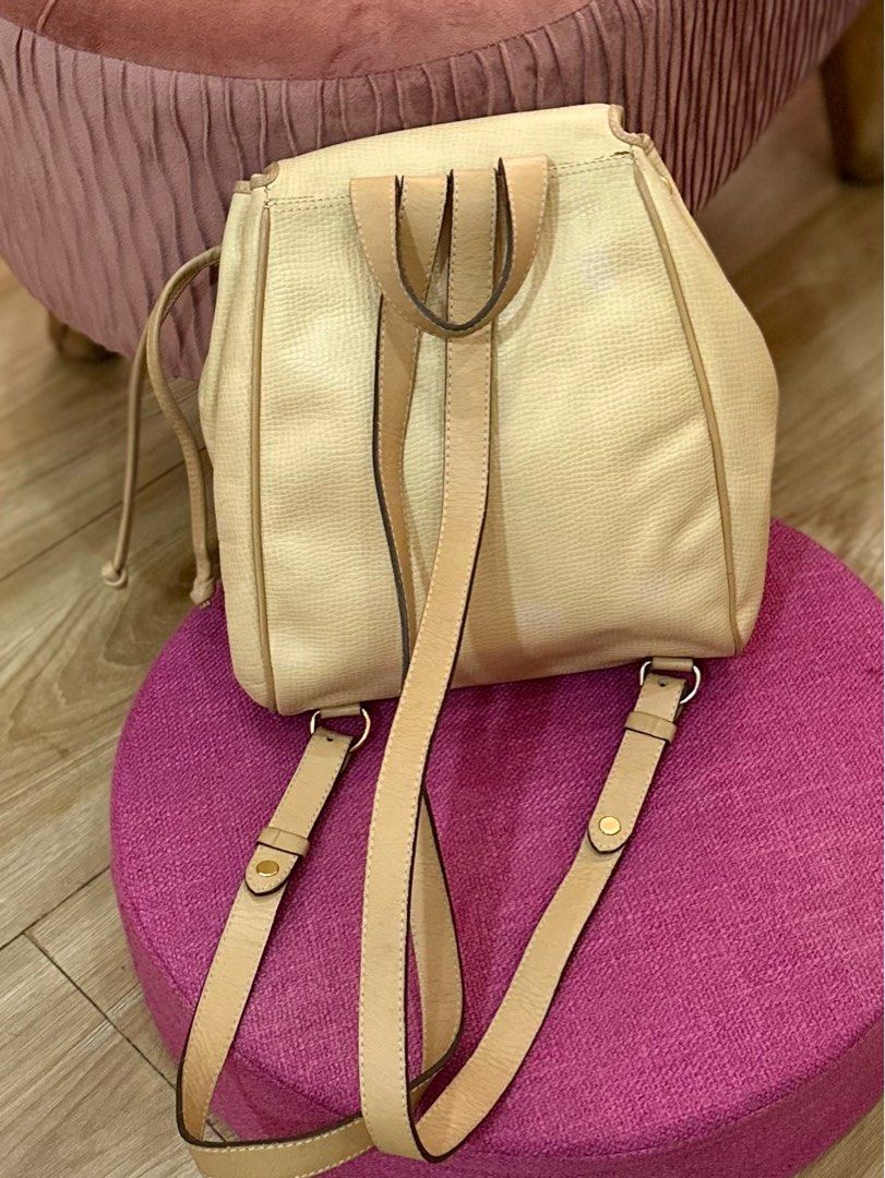 Vintage Christian Dior Backpack Yellow Leather (Category: Luxury Bags & Wallets) located in Rizal. Submitted by kimy1030 (Listing ID 1329142695, Image 3). Description: Vintage Christian Dior Yellow Leather Backpack. Gold hardware in great condition. Magnetic clasp flap closure type no flaw. .