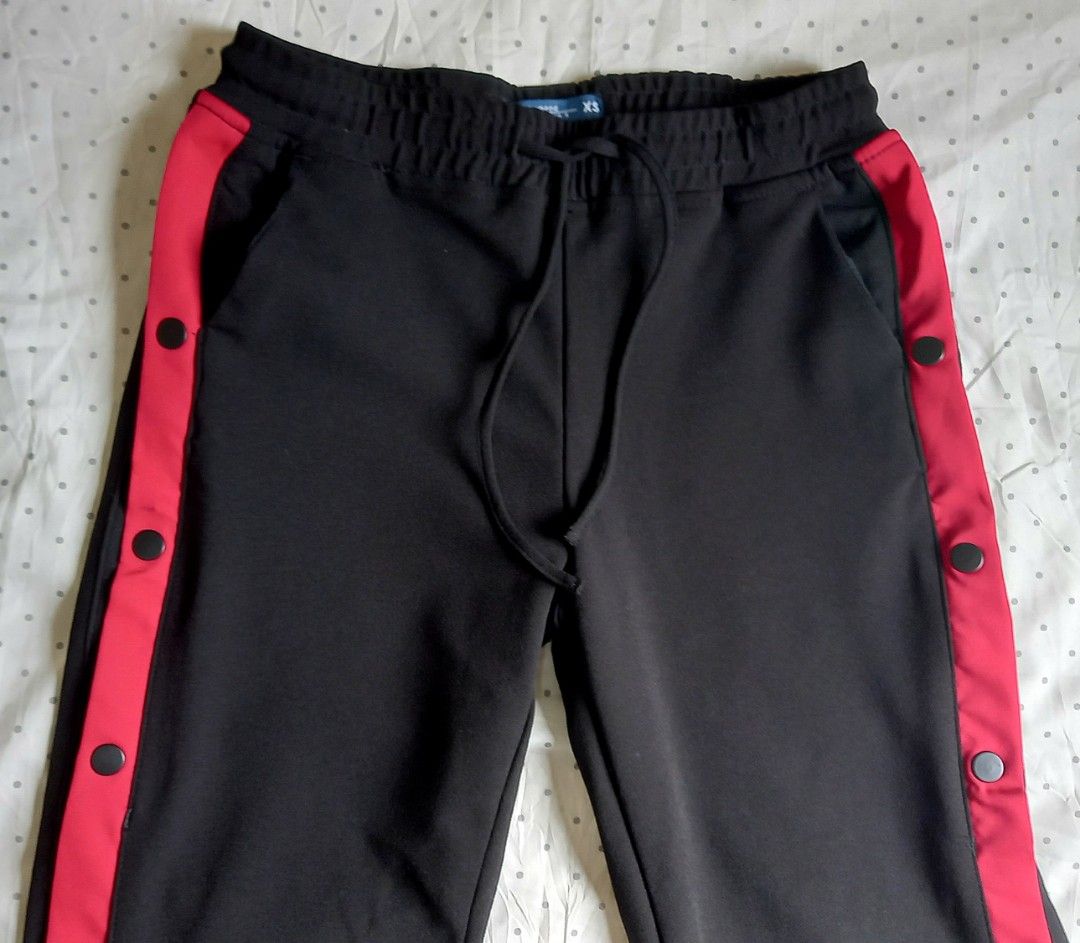 Decathlon Snap Button Track Pants (black and red) (Category: Activewear) located in Quezon City. Submitted by tinascloset_qc (Listing ID 1329325881, Image 3). Description: > open side with snap buttons > wide leg > size: small, 25-26 inch waistline > rarely used, still in good condition > brand: penshoppe > rfs: need funds, declutter.