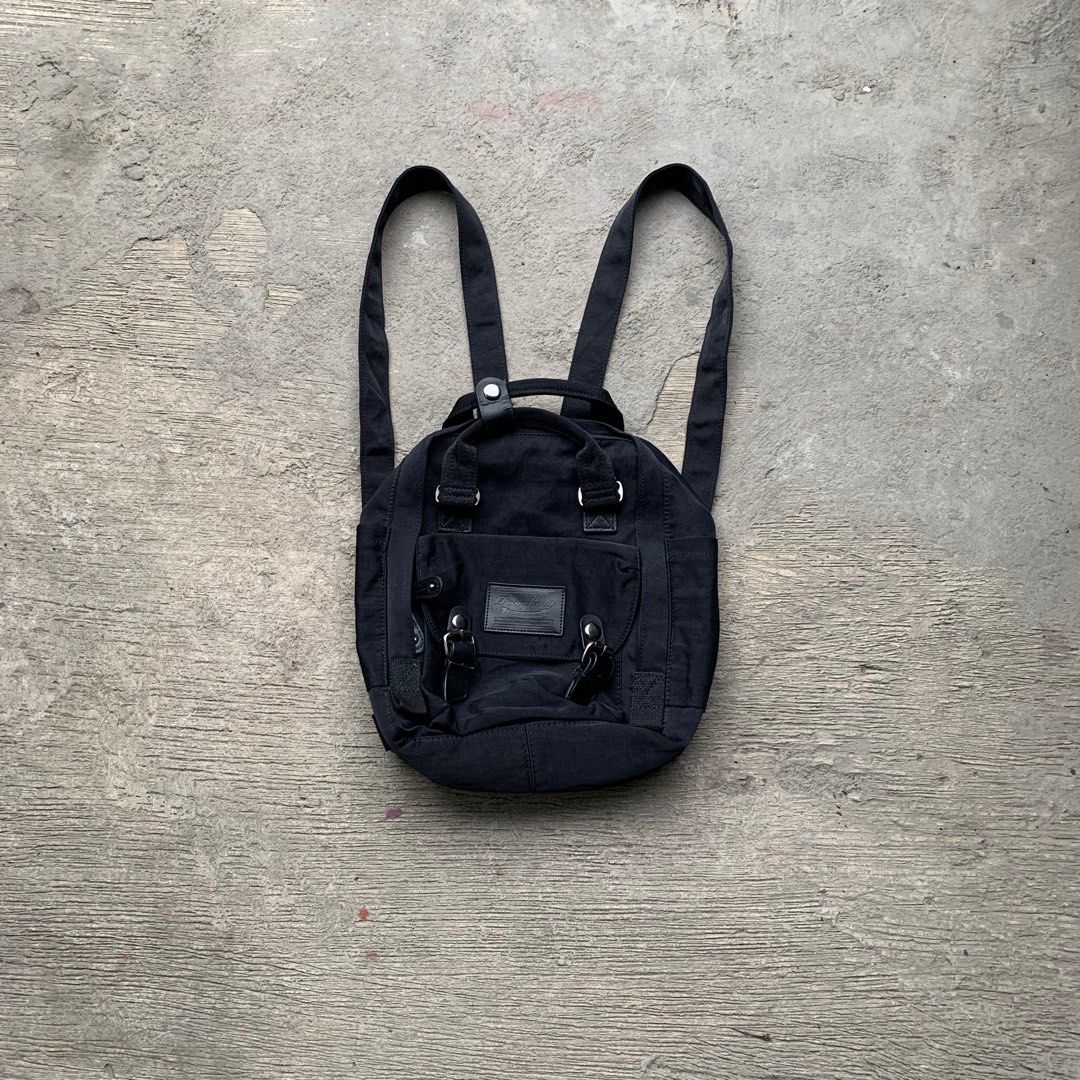 Doughnut Macaroon Mini All Black Series (Category: Backpacks) located in Manila. Submitted by fromtheflea (Listing ID 1329383265, Image 1). Description: doughnut macaroon mini all black backpack 7 liters kanken alternative; dimensions (21.5cm W x 9cm D x 30cm H) with tablet compartment; with water bottle compartment creasing on the leather buckle; washable stains in the inside 3.5k retail selling for 1200 pesos only.