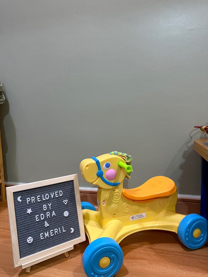FISHER PRICE ROLL ALONG MUSICAL PONY WALKER
