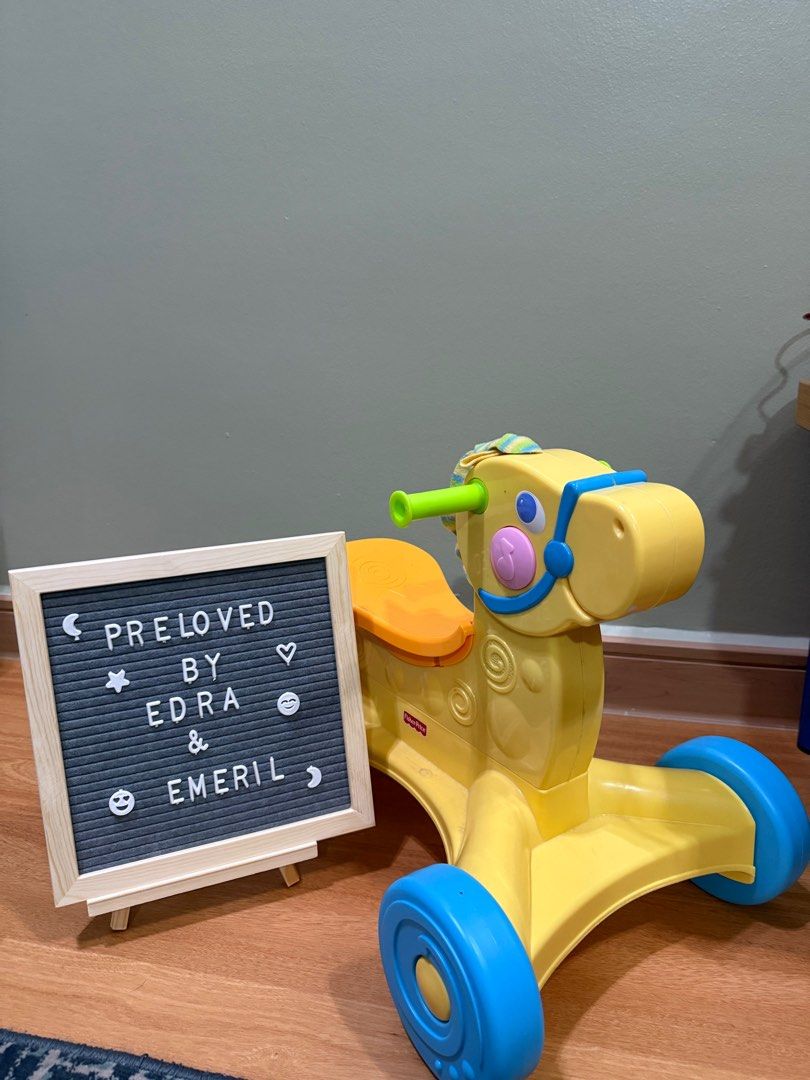 FISHER PRICE ROLL ALONG MUSICAL PONY WALKER