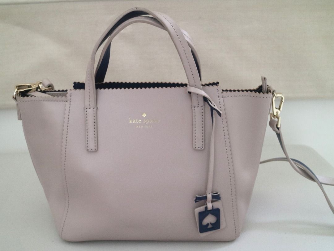 [Pre-Loved] Kate Spade Handbag (Category: Luxury Bags & Wallets) located in Pasig City. Submitted by findingviolet (Listing ID 1329373955, Image 1). Description: [Pre-Loved] Kate Spade Handbag Brand: Kate Spade Color: Beige Style: Handbag with zipper, crossbody strap Approximate Measurement: 10"W x 8"H Condition: Used - signs of use: with some minor cracking on the side (please see photo) Shipping and Fees c/o Buyer Mode of Payment: GCash / Maya 