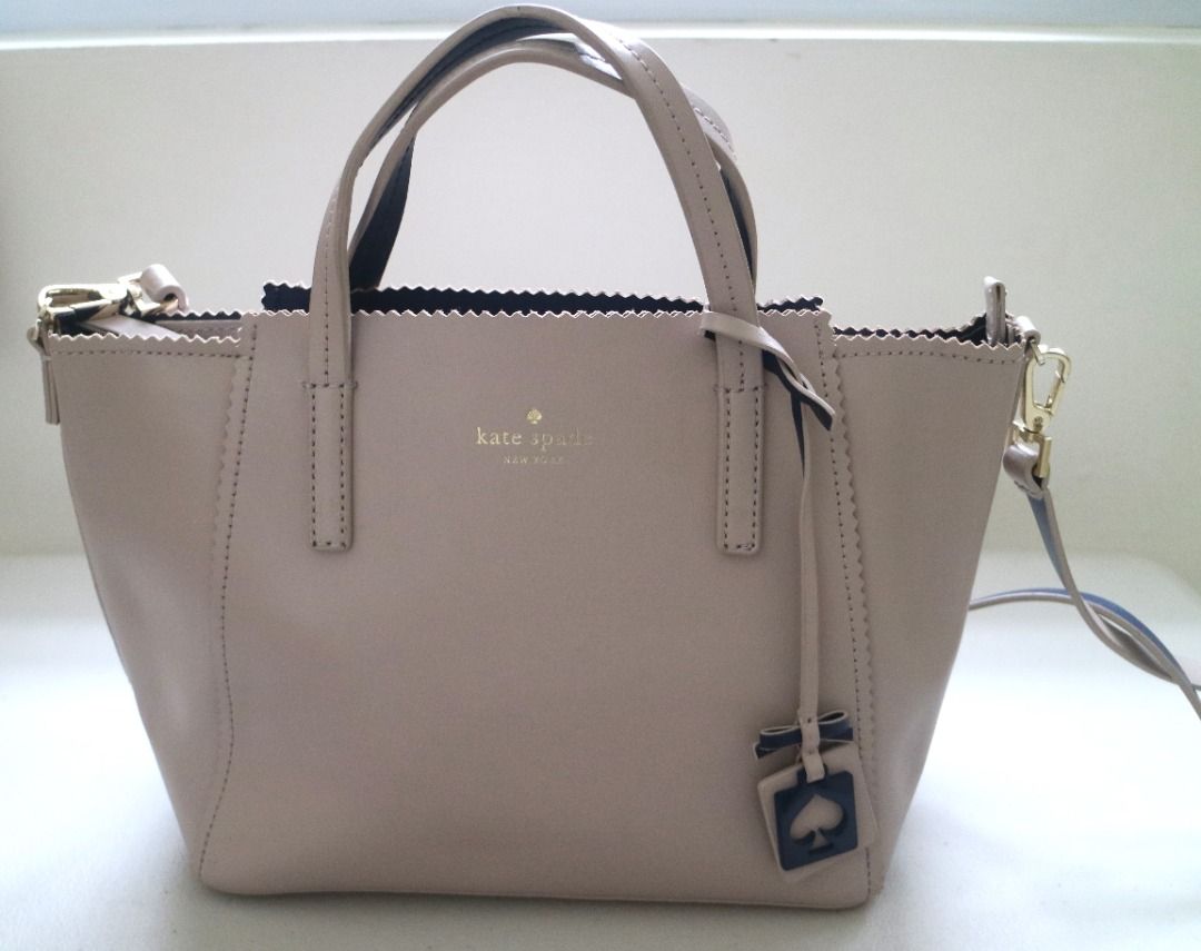 [Pre-Loved] Kate Spade Handbag (Category: Luxury Bags & Wallets) located in Pasig City. Submitted by findingviolet (Listing ID 1329373955, Image 2). Description: [Pre-Loved] Kate Spade Handbag Brand: Kate Spade Color: Beige Style: Handbag with zipper, crossbody strap Approximate Measurement: 10"W x 8"H Condition: Used - signs of use: with some minor cracking on the side (please see photo) Shipping and Fees c/o Buyer Mode of Payment: GCash / Maya 