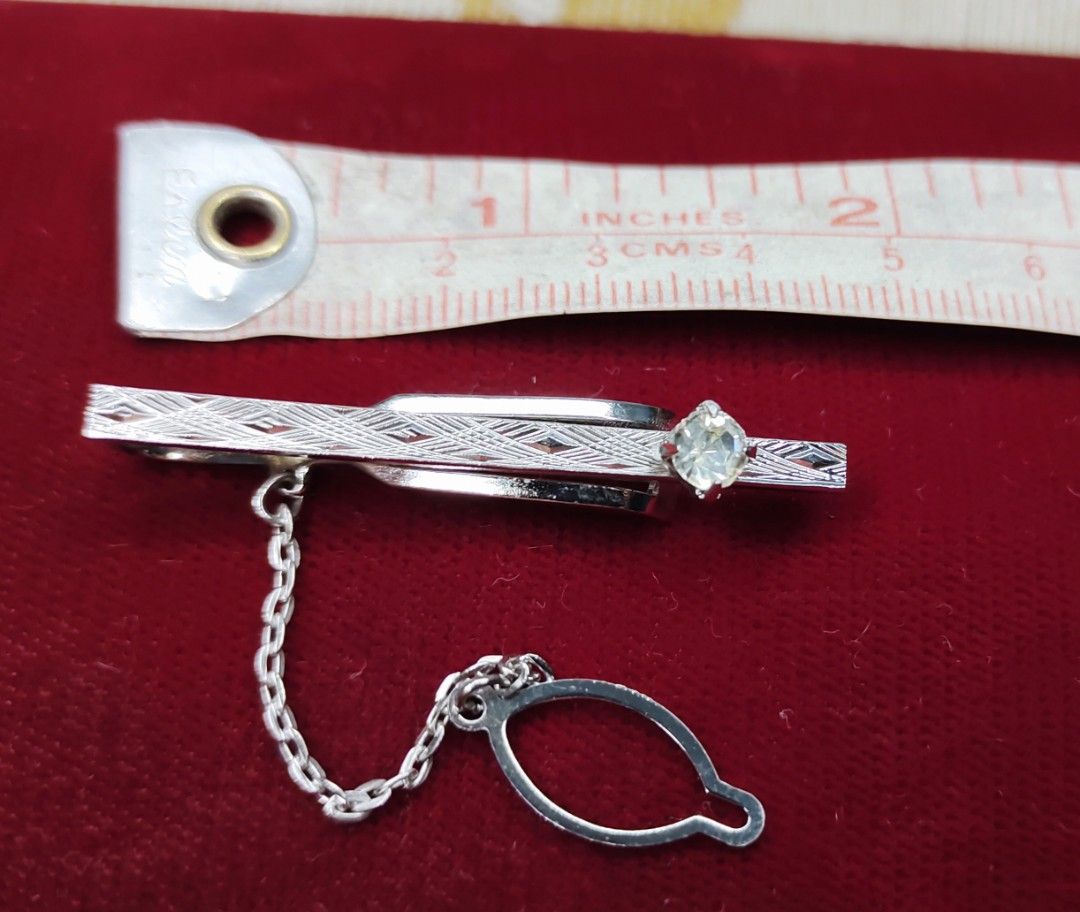 SILVER TIE CLIP WITH SILVER MARKINGS. (Category: Cuff Links) located in Pulilan. Submitted by cbssurplus (Listing ID 1329383330, Image 1). Description: SILVER TIE CLIP WITH SILVER MARKINGS FROM JAPAN.