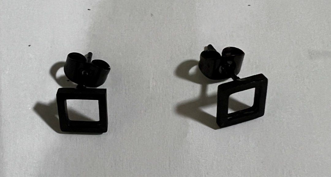 Square Stud Earrings for Men - 1 pair (Category: Jewelry) located in Manila. Submitted by berniebones (Listing ID 1329296379, Image 3). Description: Square Stud Earrings for Men 1 pair Bought in SM Color: Black Shape: Square Size: Standard (small) Type: Studs Issue: Discoloration on the part being inserted in the ear hole (not visible in photo). RFS: Not being used anymore Location: Sampaloc, Manila Last price posted.