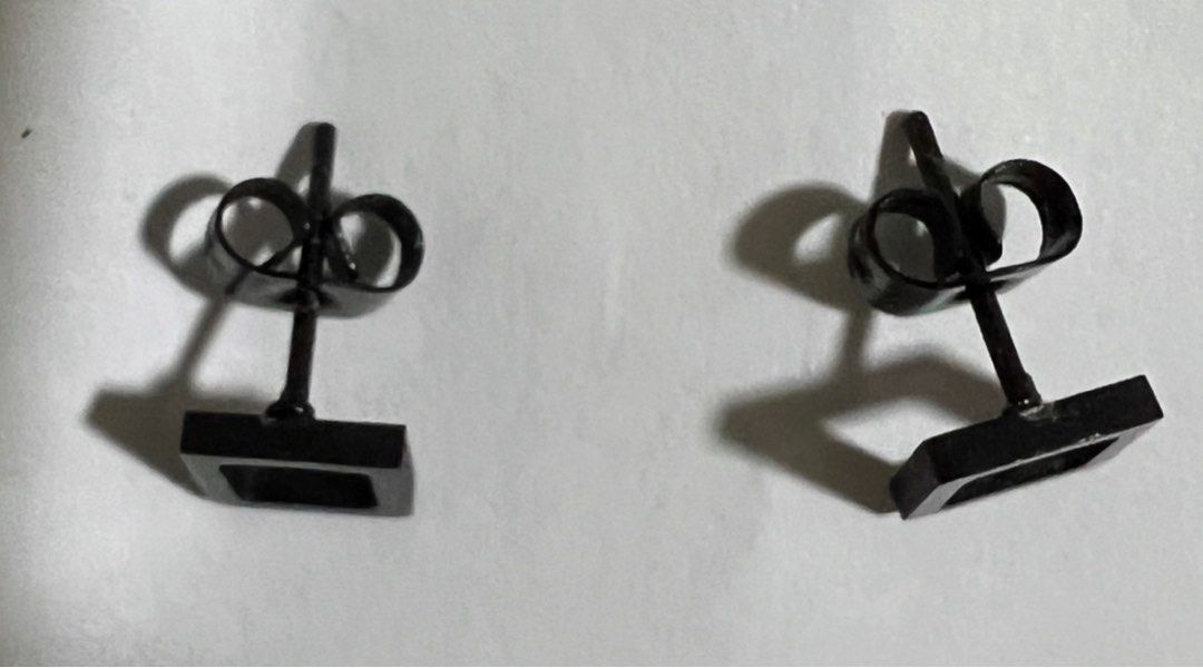 Square Stud Earrings for Men - 1 pair (Category: Jewelry) located in Manila. Submitted by berniebones (Listing ID 1329296379, Image 2). Description: Square Stud Earrings for Men 1 pair Bought in SM Color: Black Shape: Square Size: Standard (small) Type: Studs Issue: Discoloration on the part being inserted in the ear hole (not visible in photo). RFS: Not being used anymore Location: Sampaloc, Manila Last price posted.