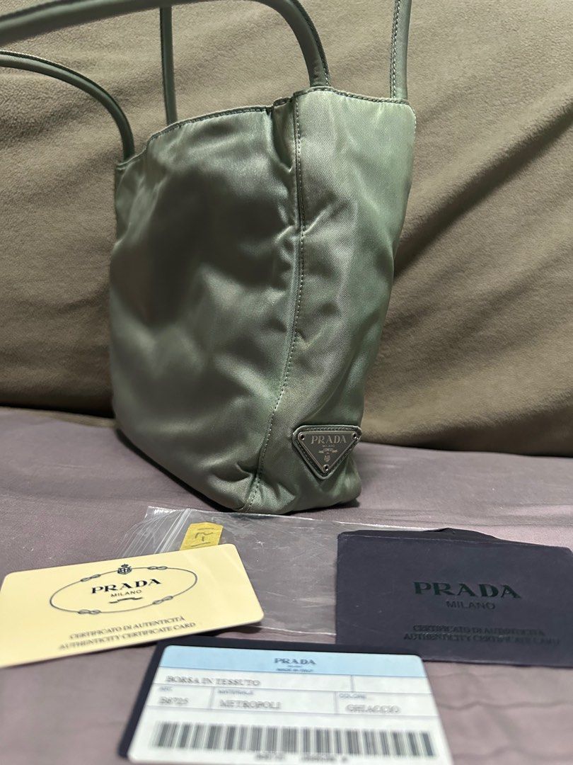 Prada (Category: Bags & Wallets) located in Singapore. Submitted by sell_02 (Listing ID 1329628890, Image 3). Description: Selling my pre-loved Prada Tessuto Metropolis Bag in the color Ghiaccio (Ice Gray).Its fabric made, Bought it in japan got authenticity card but no dust bag and box included..