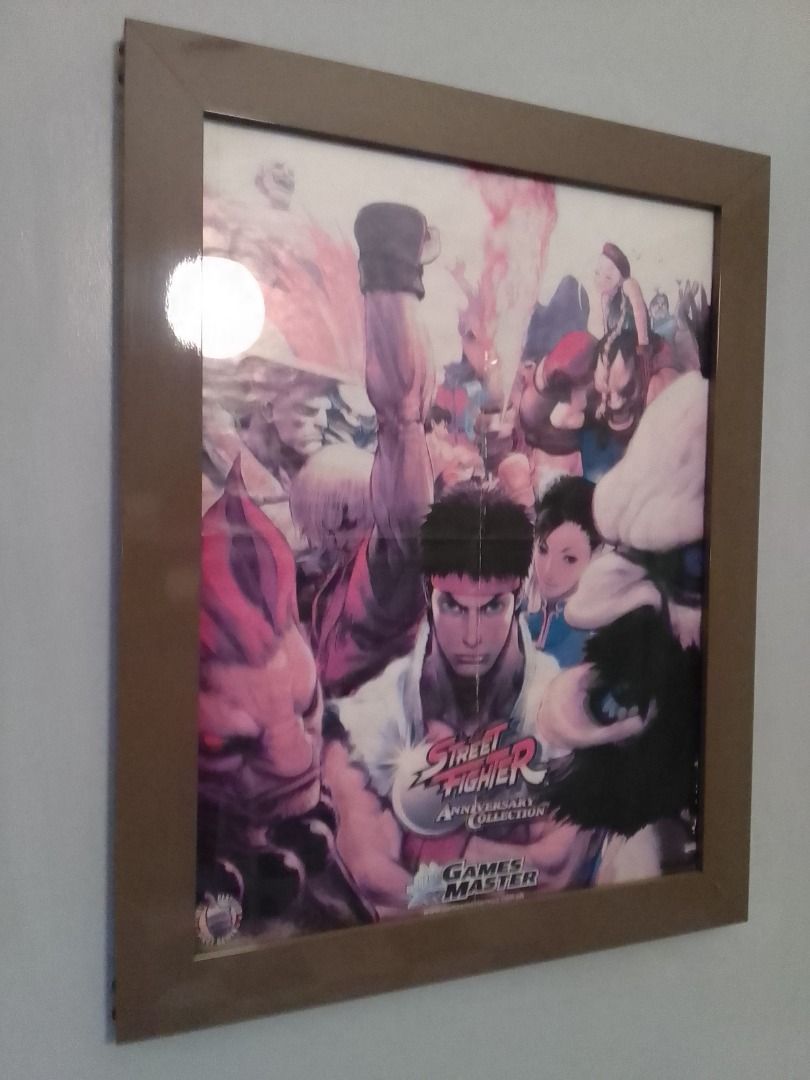 STREET FIGHTER ANNIVERSARY COLLECTION POSTER (FRAMED) (Category: Art & Prints) located in Mandaluyong City. Submitted by neko.neko21 (Listing ID 1329525963, Image 3). Description: SIZE : 19.5 X 25 (FRAME INCLUDED) FORMAT : POSTER REMARK : - POSTER FROM GAME MASTER'S MAGAZINE - WITH FOLD - POSTER FRAMED WITH ANONIZED METAL (SAND BROWN) AND GLASS PAYMENT METHOD - BDO - BANK OF COMMERCE - G CASH - CASH (on pick up) * PICK UP - PICK UP - Talia Bldg. 
