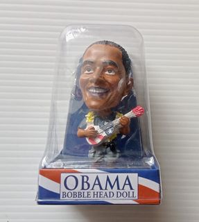Barack Obama Holding a Surfboard