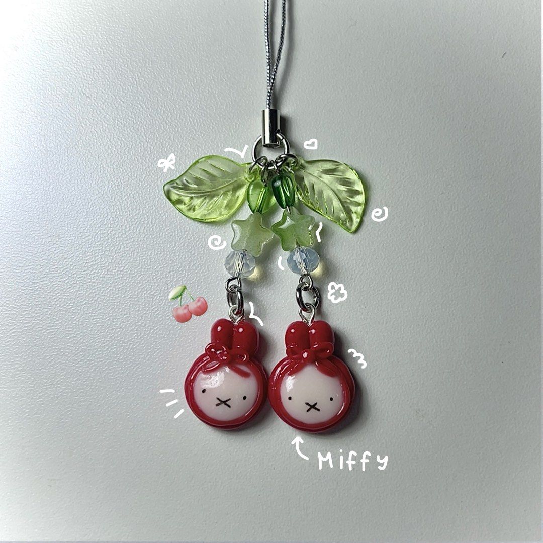 Miffy Red Cherry Themed Beaded Wire Phone Charm Keychain (Category: Charms) located in Quezon City. Submitted by elysianpieces.ph (Listing ID 1329812890, Image 1). Description: ~ Made to order (3-4 days) ~ Handmade, please manage expectations! ~ Miffy red cherry themed phone charm ~ Inspired by Sylvanian Families / Calico Critters cherry keychain ~ Miffy charms made from air dry clay ~ Kindly DM if you are interested or if you have any questions!