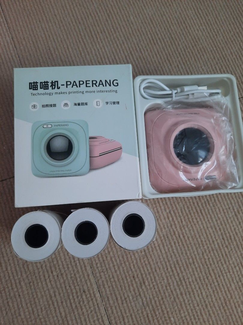 WITH MORE FREEBIES! PAPERANG | INSTANT PRINTER | PINK| THERMAL PRINTER | HANDY (Category: Printers, Scanners & Copiers) located in Cavite. Submitted by jam90053 (Listing ID 1329720216, Image 2). Description: Brand new! Gamitin sana sa small business but di natuloy! No damage! 💯 With free 3 Thermal Paper and more freebies! RFS: Need funds 🙏.