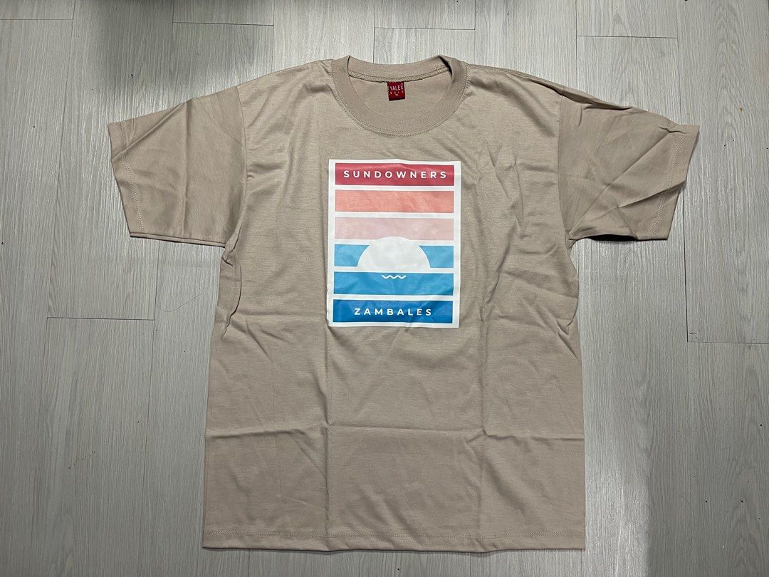 Sundowners Souvenir Shirt (Category: Tshirts & Polo Shirts ) located in Quezon City. Submitted by decluttering.rightnow (Listing ID 1329729407, Image 2). Description: PLEASE READ EVERYTHING FIRST Sundowners Souvenir T Shirt New Never Worn No issue XL Length: 27.5” Width: 21” PHP 150 Discount on bulk purchase please check my other listings 😊 Location: Scout Area Quezon City (Timog Tomas Morato) Shipping c/o buyer via lalamove within Metro Manila 