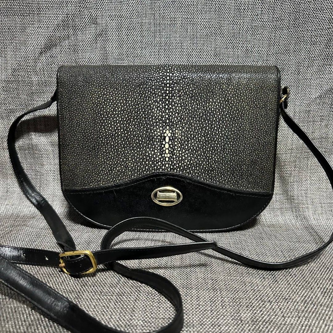 Stingray skin sling bag (Category: Cross-body Bags) located in Manila. Submitted by greyinfash06839 (Listing ID 1329991963, Image 1). Description: 🤍Price: 4,900 pesos only 🤍Item: Stingray skin sling bag 🤍Brand: Unknown 🤍Matirial: Leather 🤍Quality: Original 🤍color: Black 🤍Size: Small 🤍Dimension. H: 7 L: 9 W: 2 🤍Sex: For women 🤍Issue: Sign of use 🤍Condition Rate: 8/10 🤍Other info:.