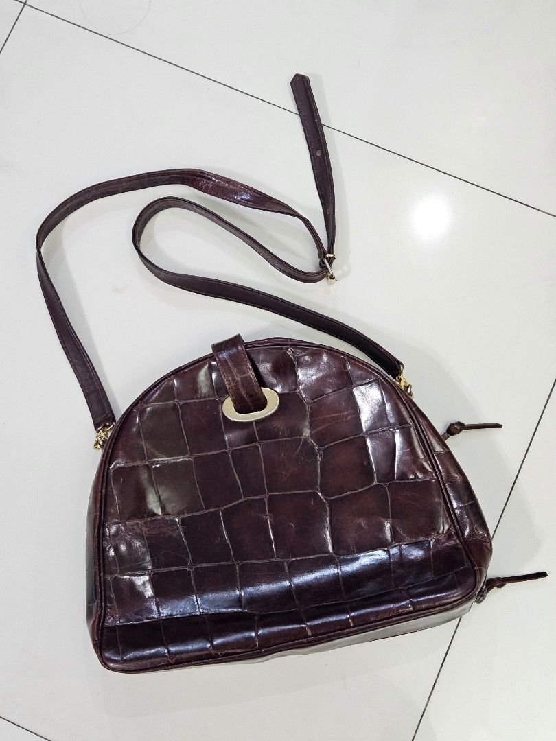 Crocodile skin Genuine Leather Bag (Category: Cross-body Bags) located in Paranaque City. Submitted by icabelulia (Listing ID 1333938559, Image 1). Description: genuine leather crocodile skin brown with visible signs of usage as seen on photos but otherwise, in super good condition. medium size.