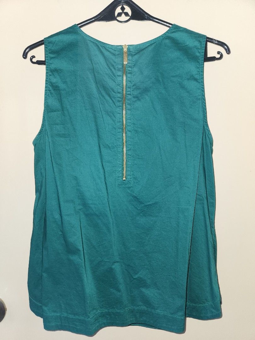 Crown & Ivy green sleeveless top (Category: Sleeveless) located in Manila. Submitted by mistanggg (Listing ID 1333912516, Image 3). Description: NO WHEN WORN PHOTOS ✅️ Very cute solid green shade ✅️ Velvet ribbons around neckline ✅️ Zipper at the back ✅️ Wrinkled in photos due to storage, no flaws in actual ❌️ Non-stretch fabric Dimensions (when laid flat): Shoulder - 12" Bust - 18" Waist - 19" Armhole - 8.5" Length - 24".
