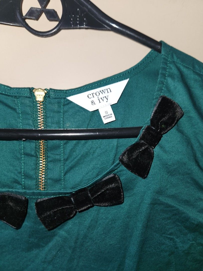 Crown & Ivy green sleeveless top (Category: Sleeveless) located in Manila. Submitted by mistanggg (Listing ID 1333912516, Image 2). Description: NO WHEN WORN PHOTOS ✅️ Very cute solid green shade ✅️ Velvet ribbons around neckline ✅️ Zipper at the back ✅️ Wrinkled in photos due to storage, no flaws in actual ❌️ Non-stretch fabric Dimensions (when laid flat): Shoulder - 12" Bust - 18" Waist - 19" Armhole - 8.5" Length - 24".