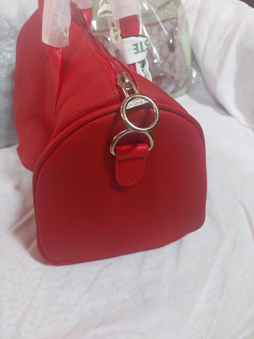 Doctor's Lacoste Bag (Category: Tote Bags) located in Bulacan. Submitted by ourdailyfinds (Listing ID 1333908133, Image 2). Description: Lacoste Red Doctor's Bag – Japan Edition! PHP 2,000 Add a pop of color to your wardrobe with this unique Lacoste Red Doctor's Bag, a Japan-exclusive design that combines style and functionality! Featuring the iconic Lacoste logo, this bag is crafted with attention to detail, perfect for those who love timeless p