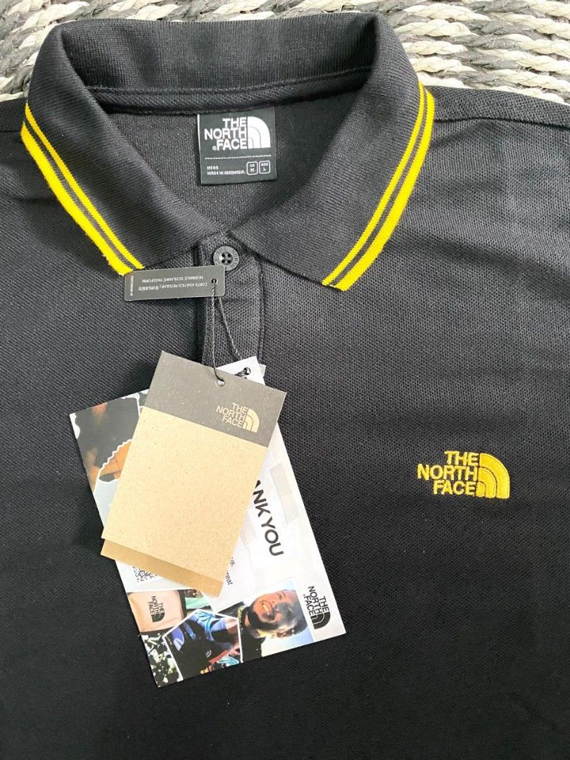 The North Face Polo Tshirt black list yellow