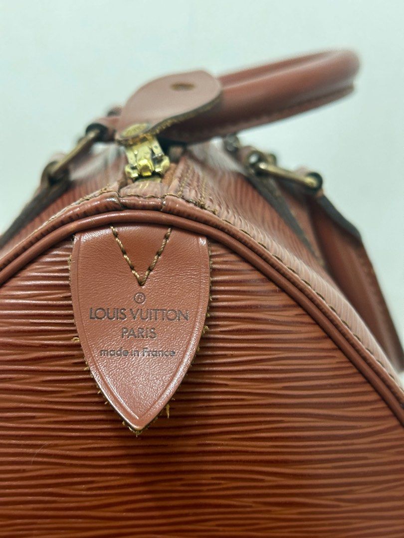 Authentic Louis Vuitton LV speedy size 25 brown epi leather (Category: Luxury Bags & Wallets) located in San Pedro. Submitted by Crue.collection (Listing ID 1335539059, Image 3). Description: AUTHENTIC GENUINE Code: VI0993 Brown epi leather No dust bag no box Bought from Japan Shape is well preserved with solid thick paper backing to hold the shape With organizer No visible damage.