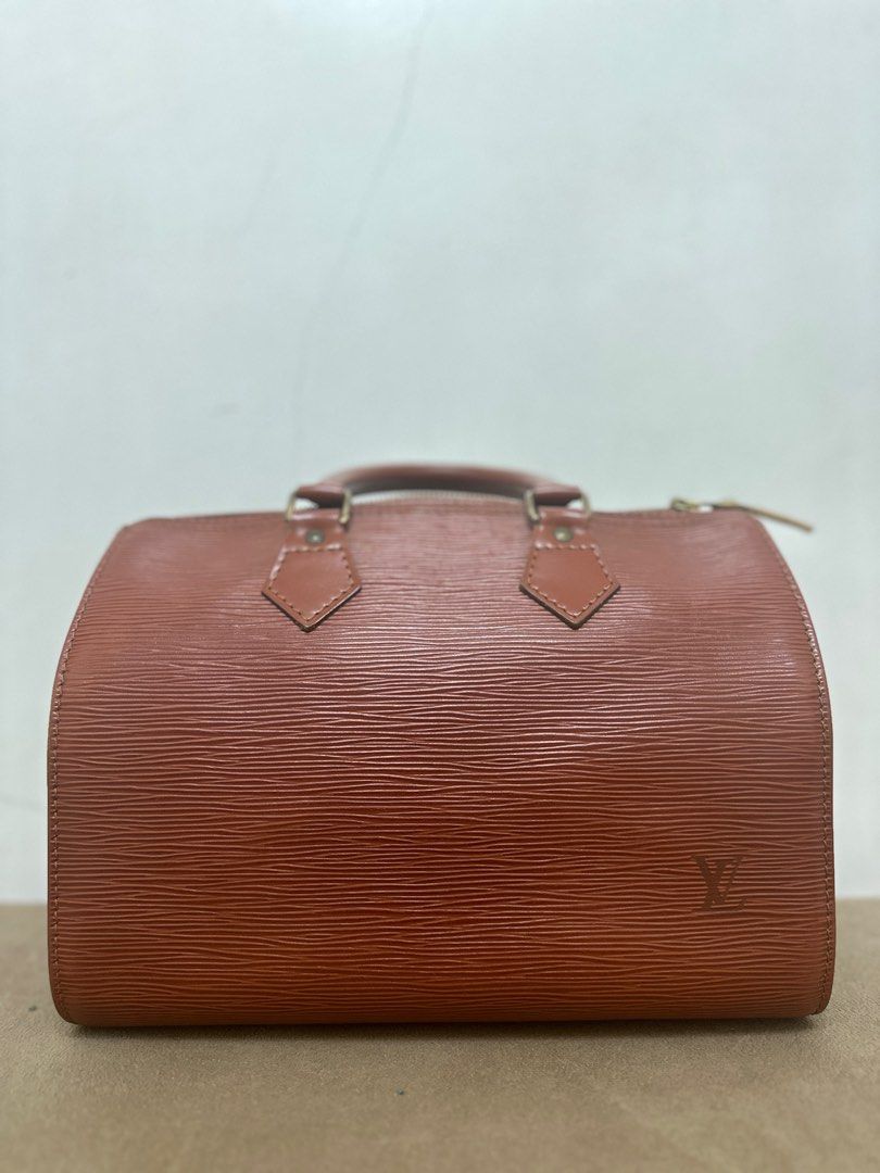 Authentic Louis Vuitton LV speedy size 25 brown epi leather (Category: Luxury Bags & Wallets) located in San Pedro. Submitted by Crue.collection (Listing ID 1335539059, Image 1). Description: AUTHENTIC GENUINE Code: VI0993 Brown epi leather No dust bag no box Bought from Japan Shape is well preserved with solid thick paper backing to hold the shape With organizer No visible damage.