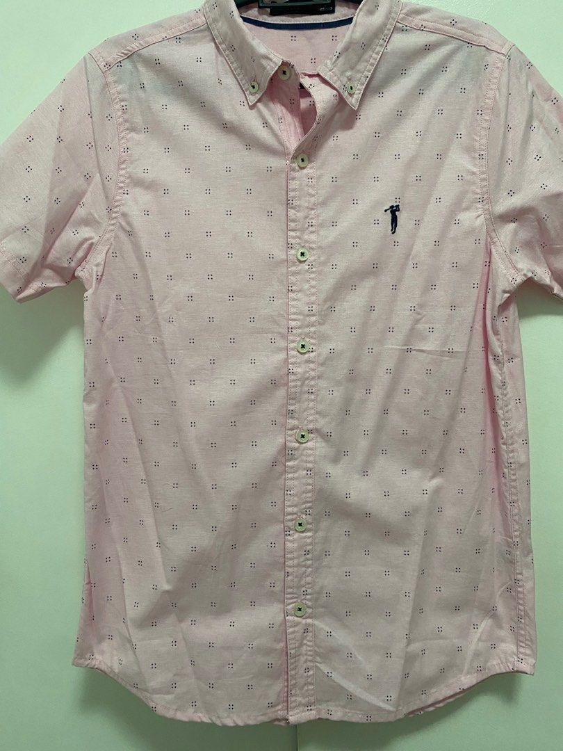 Bossini button down polo (Category: Formal Shirts) located in Quezon City. Submitted by fcsv89 (Listing ID 1335511495, Image 2). Description: Never worn. Nalabhan lang once then di na nagamit. Complete buttons No armpit stains .