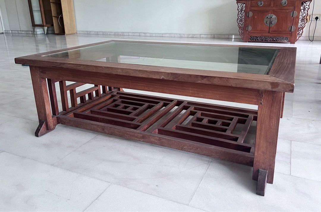 Solid teak Coffee table (Category: Tables & Sets) located in Singapore. Submitted by teamm2 (Listing ID 1335429851, Image 2). Description: Coffee table is made of solid teak wood with beautiful lattice work. Please check pics for imperfections. Table will be cleaned and oiled before delivery. Please arrange delivery at 510779. Thanks. .