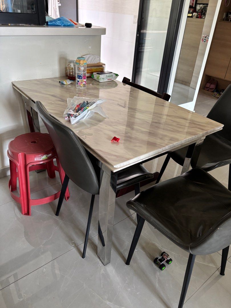 Extendable marble Dining Table (Category: Tables & Sets) located in Singapore. Submitted by chitodog (Listing ID 1335431021, Image 2). Description: Bought around 4 years ago. Can extend table in both sides! Let me know if you need more dimensions.