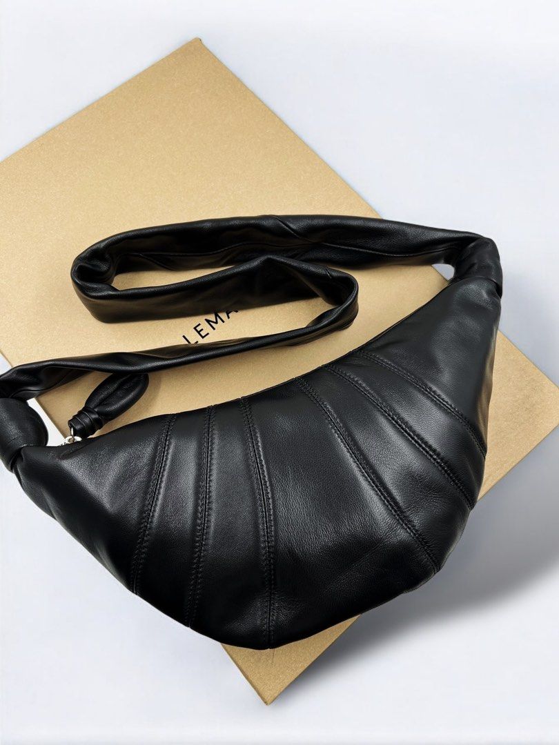 ⚜️Lemaire Croissant 🥐 bag (Category: Luxury Bags & Wallets) located in Makati City. Submitted by 90sangel (Listing ID 1335580650, Image 1). Description: •Item: Rare and hard to get, Lemaire croissant 🥐🥐 bag 🖤 as seen on famous k celebrities! •Size: Small, so nice! •Condition: Excellent! 💯 *This classic 🥐🖤LEMAIRE bag is part of the iconic Croissant family. It is made of soft lamb nappa leather, a fabric that is supple yet resistant. *The Sm