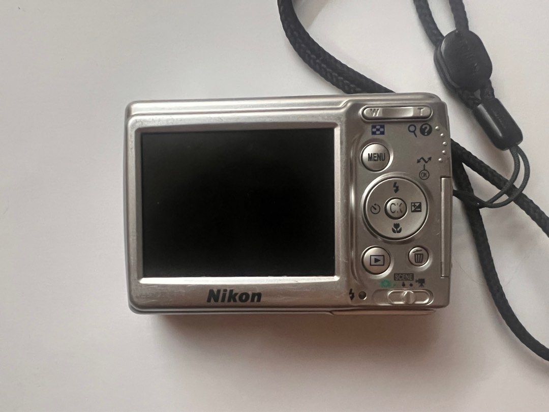 Nikon L12 - FOR REPAIR - DIGICAM (Category: Cameras) located in Manila. Submitted by bwakbwak (Listing ID 1335532464, Image 2). Description: - 2nd hand condition (has few scratches) - FOR REPAIR - kinargahan ng battery tapos di natanggal ng ilang months causing the leak (check 5th photo) - no time to get it repaired myself kayo na lang. NO RETURN & REFUND. BUY AT YOUR OWN RISK! .