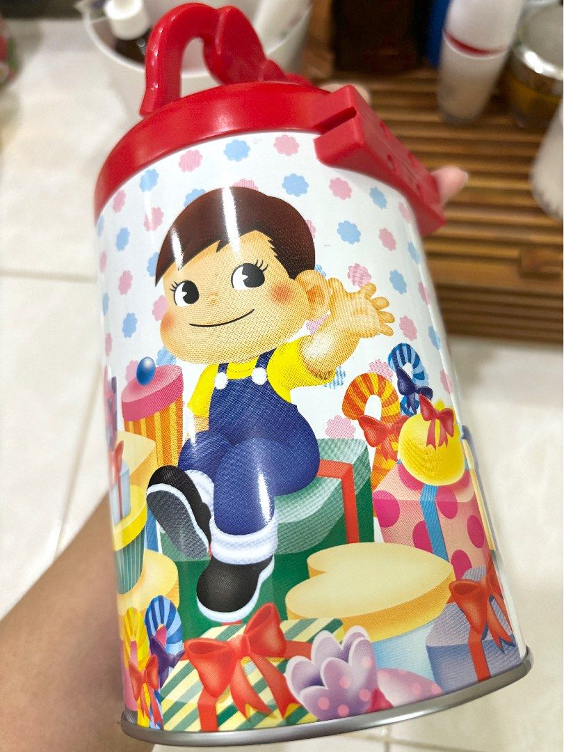 Peko Chan Medium Tin Can Cylinder Case with Handle (Category: Vintage Collectibles) located in Cebu City. Submitted by kawaiiparty (Listing ID 1335497952, Image 2). Description: Good as new No flaws Authentic Peko Chan tin can Good for your aniks or candies .