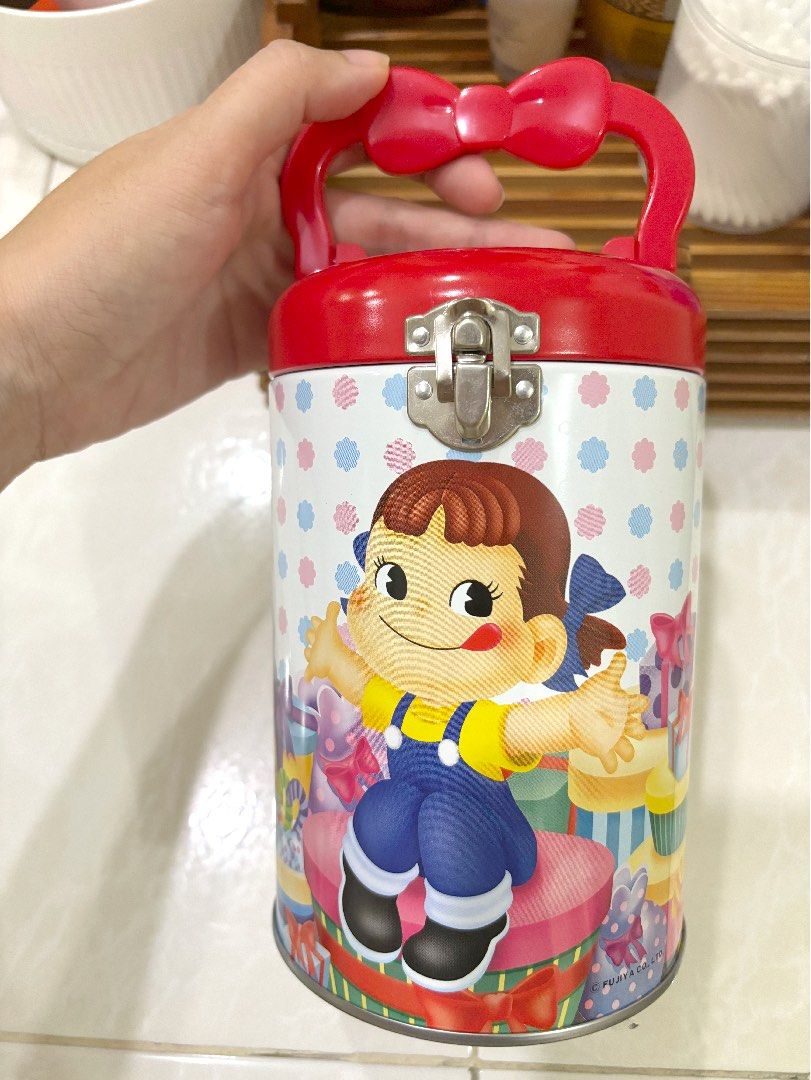 Peko Chan Medium Tin Can Cylinder Case with Handle (Category: Vintage Collectibles) located in Cebu City. Submitted by kawaiiparty (Listing ID 1335497952, Image 1). Description: Good as new No flaws Authentic Peko Chan tin can Good for your aniks or candies .